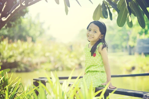 Little girl sittingoutside — Stock Photo, Image