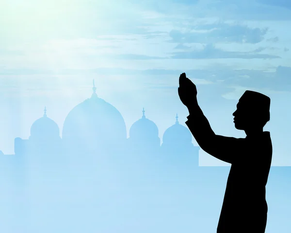 Silhouette of muslim people praying — Stock Photo, Image