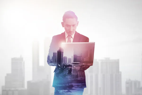 Business man with multiple exposure holding tablet computer — Stock Photo, Image