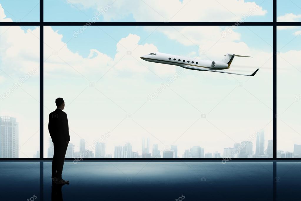 Man looking on the private jet