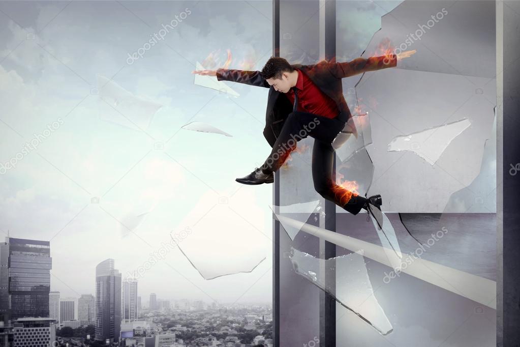 Man escape from office through window with flame all over body