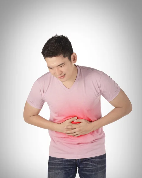 Asian man have stomach ache — стокове фото