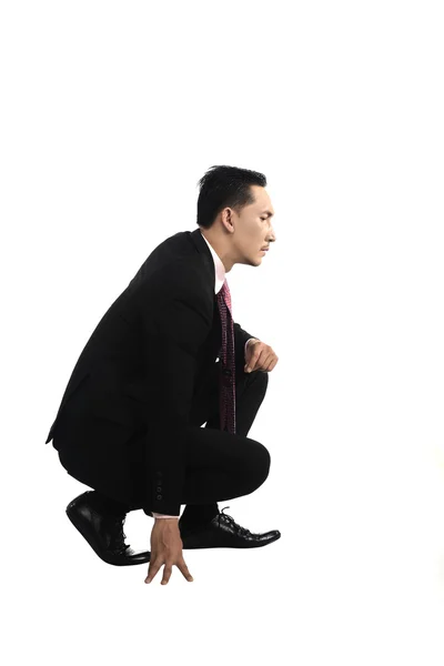 Azjatycki biznes człowiek squat — Zdjęcie stockowe