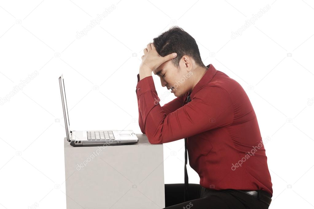 business man with stress working with laptop