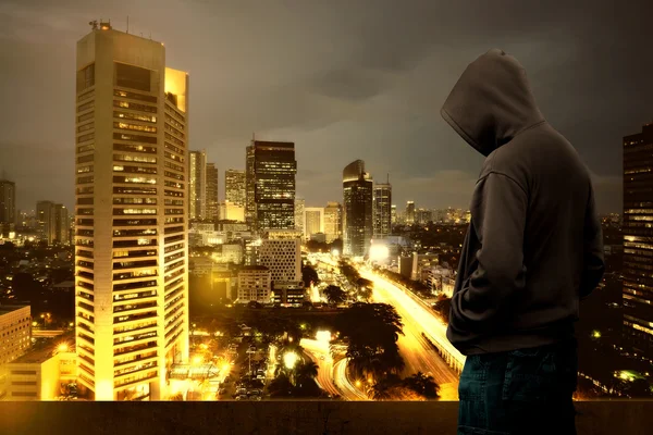 Computer hacker silhouette of hooded man — Stock Photo, Image