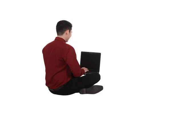 Business man working on a laptop on the floor — Stock Photo, Image