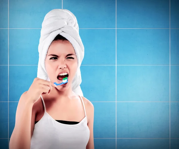 Woman with great teeth holding tooth-brush — Stock Photo, Image