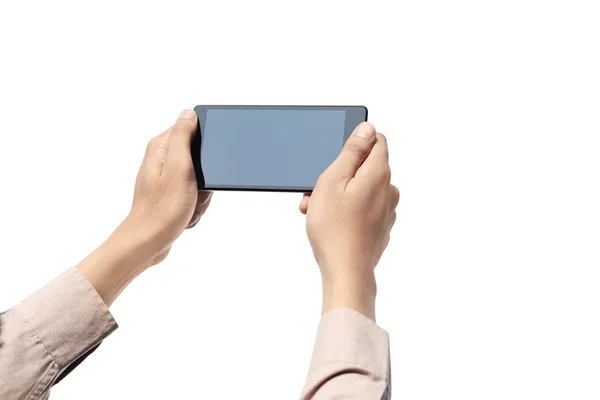 Mano sosteniendo el teléfono celular con pantalla en blanco — Foto de Stock