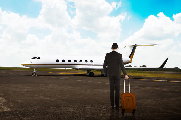 Business man carrying suitcase