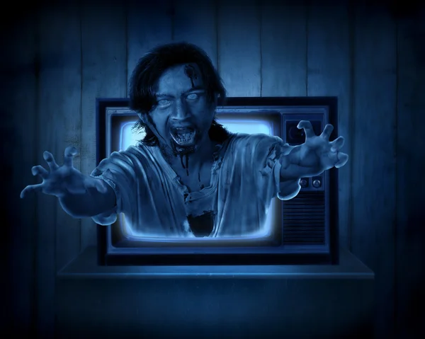 Scary ghost out from old television — Stock Photo, Image