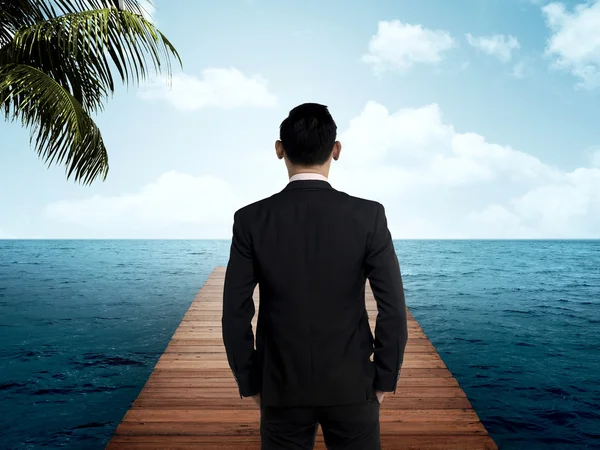 Business person on the wooden pier — Stock Photo, Image