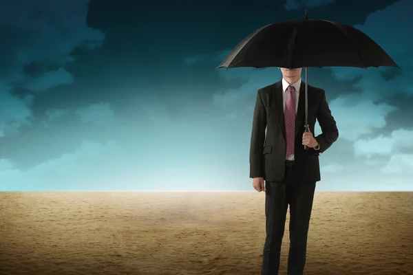 Business Person Hold Umbrella On Desert Stock Image