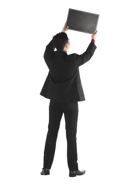 Young business man holding chalk board — Stock Photo, Image