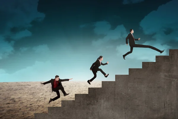 Business team race to the top stair — Stock Photo, Image