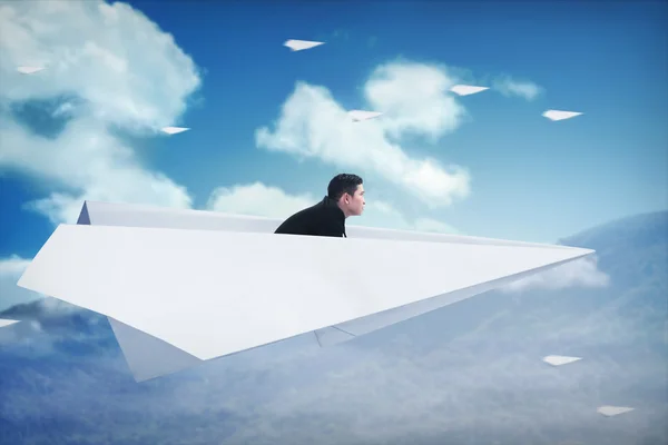 Uomo d'affari che vola con aereo di carta — Foto Stock