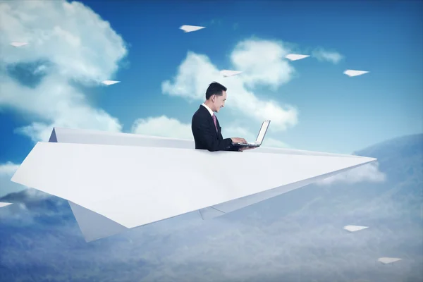 Asian business man working on paper plane — Stock Photo, Image