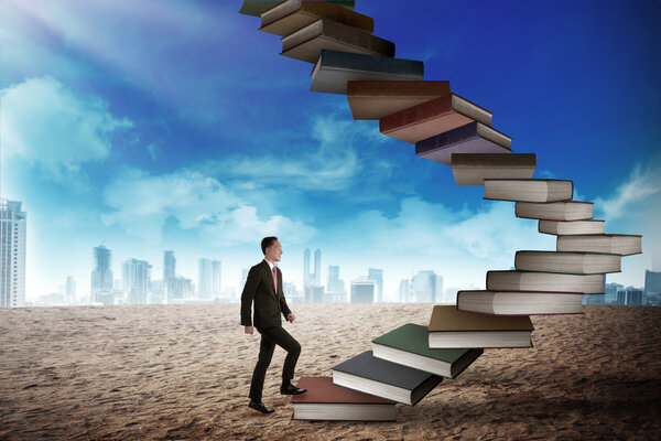 Businessman step up flying books