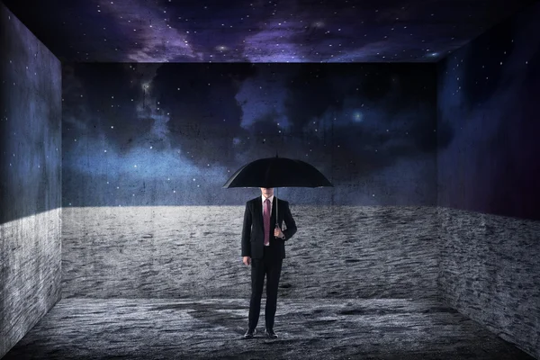 Asian business man holding umbrella — Stock Photo, Image