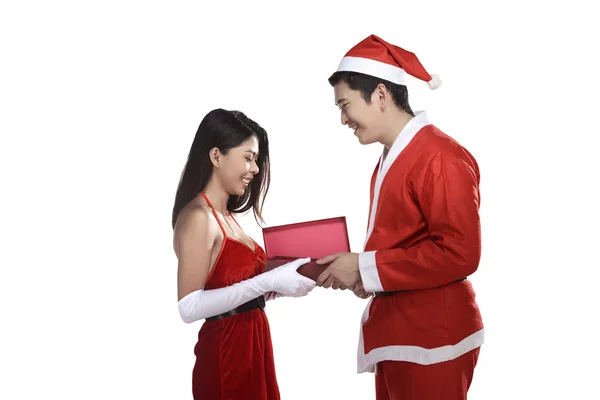 Lovely christmas couple open present — Stock Photo, Image