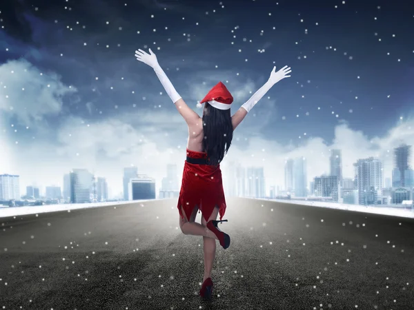 Woman standing on the street wearing santa claus costume — Stock Photo, Image