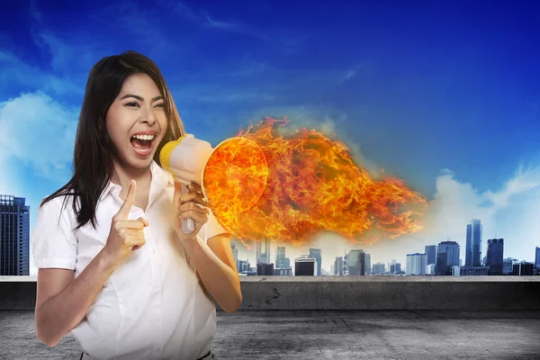 Asian businesswoman with a megaphone — Stock Photo, Image