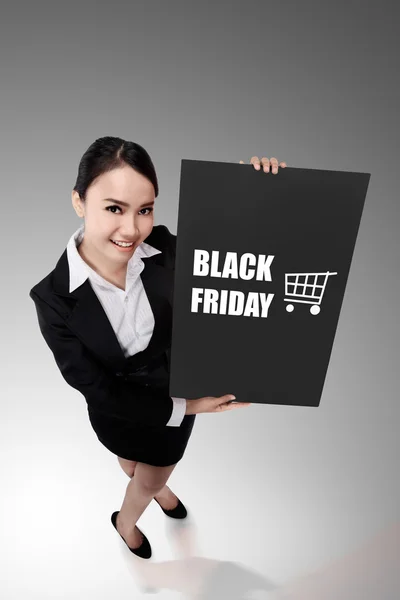 Frau mit Black-Friday-Banner — Stockfoto