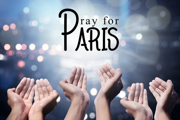 Ανθρώπινα χέρια προσεύχονται για Παρίσι περιστατικό — Φωτογραφία Αρχείου