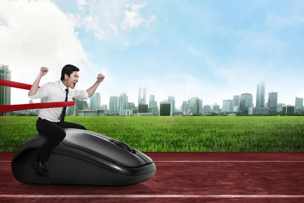 Business person riding computer mouse — Stock Photo, Image