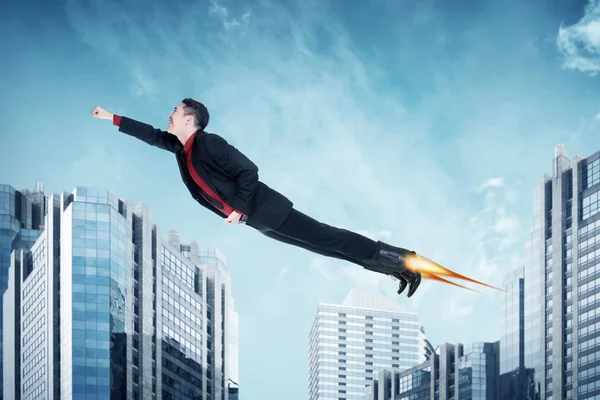 Businessman flying with rocket — Stock Photo, Image