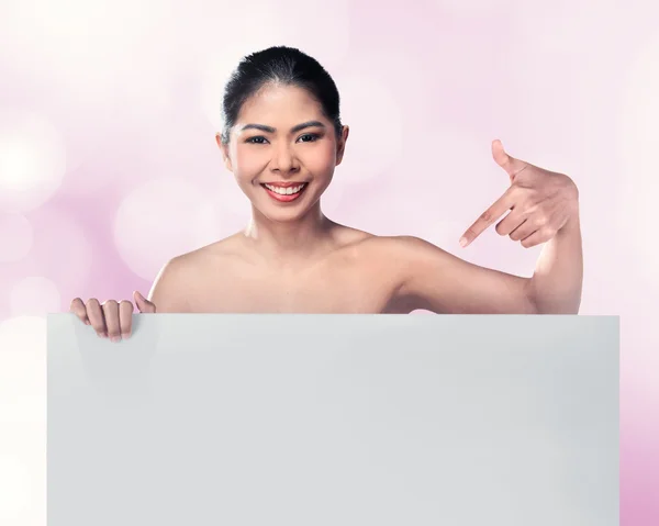 Woman pointing blank board — Stock Photo, Image