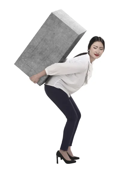 Business woman lift heavy box — Stock Photo, Image