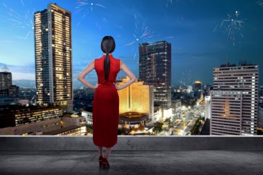 Chinese woman on rooftop watching the fireworks clipart