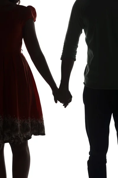 Silhouette of couple holding hands — Stock Photo, Image