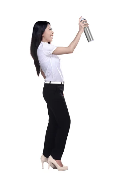 Asian businesswoman spraying something — Stock Photo, Image