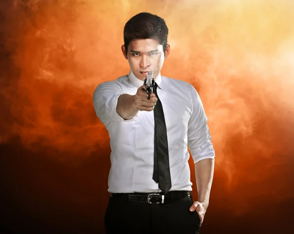 Secret agent holding gun — Stock Photo, Image