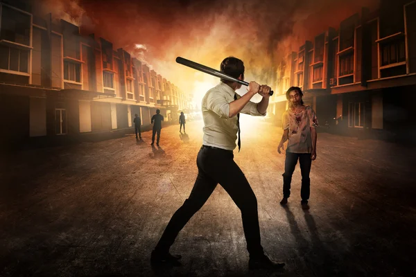 Man with baseball bat fighting with zombies — Stock Photo, Image