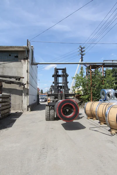 View of the storage of steel coils with loader — Stock Photo, Image