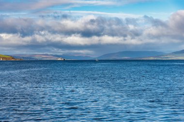 From The town of Largs set on the Firth of Clyde Looking Over to Rothesay and Dunoon in the West of Scotland with a Dramatic winter sky clipart