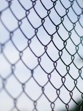 Abstract Chain Link Fence Pattern with Selective Focus - Minimalist Wire Mesh Texture with Soft Bokeh Background