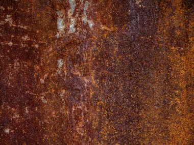 Yoğun paslanmış metal yüzey dokusu, turuncu kahverengi korozyon oksitlenmesi ve yıpranmış arkaplan yapısı.