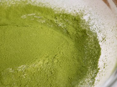 Matcha Green Tea Powder in White Bowl Yakın çekim Doku Detayları