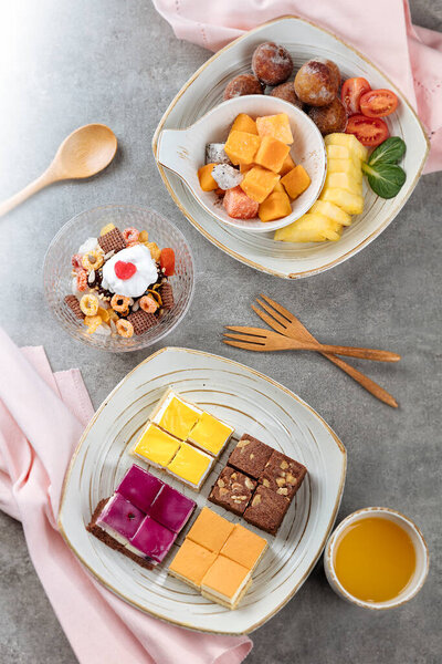 Top view of cereal and cakes on a table