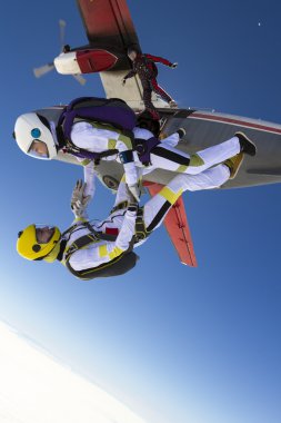 parachutists jumping out of an airplane