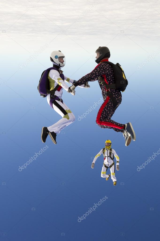 girl and guy skydivers perform pieces