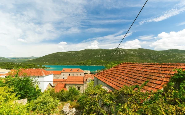 Mediterranean houses with red roofs and Adriatic Sea in the background, Dalmatia, Croatia
