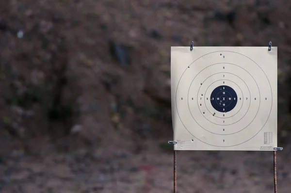 Target practice at outdoor shooting range. paper target and steel plate target