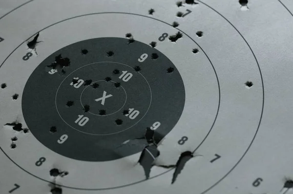 Target practice at outdoor shooting range. paper target and steel plate target