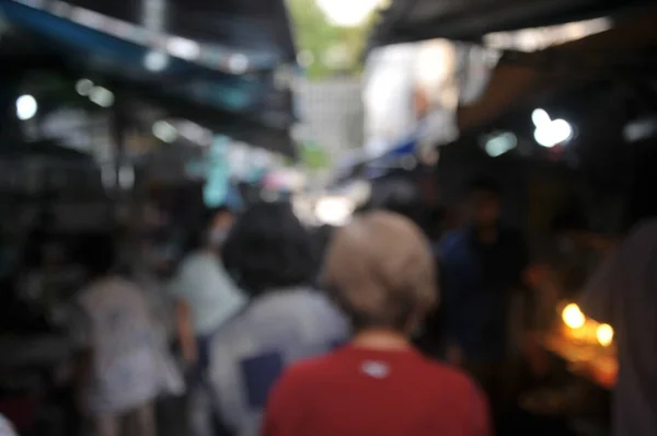 Blurred Peoples are wearing protective masks prevent Coronavirus, Covid-19 virus during virus outbreak and PM2.5 air pollution crisis rush hour in the public.