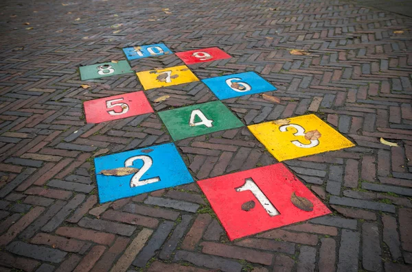 Hopscotch game on street — Stock Photo, Image