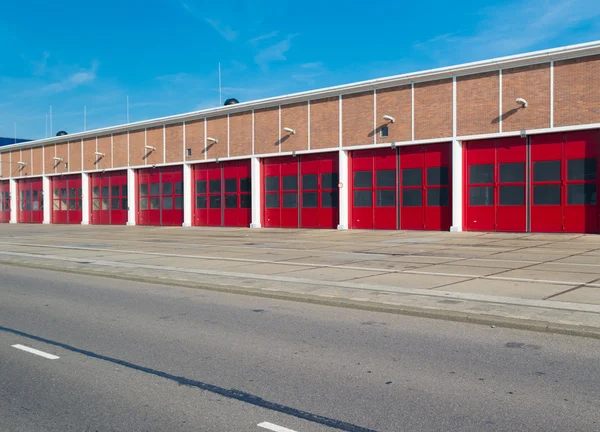 Warehouse with red doors — Stock Photo, Image